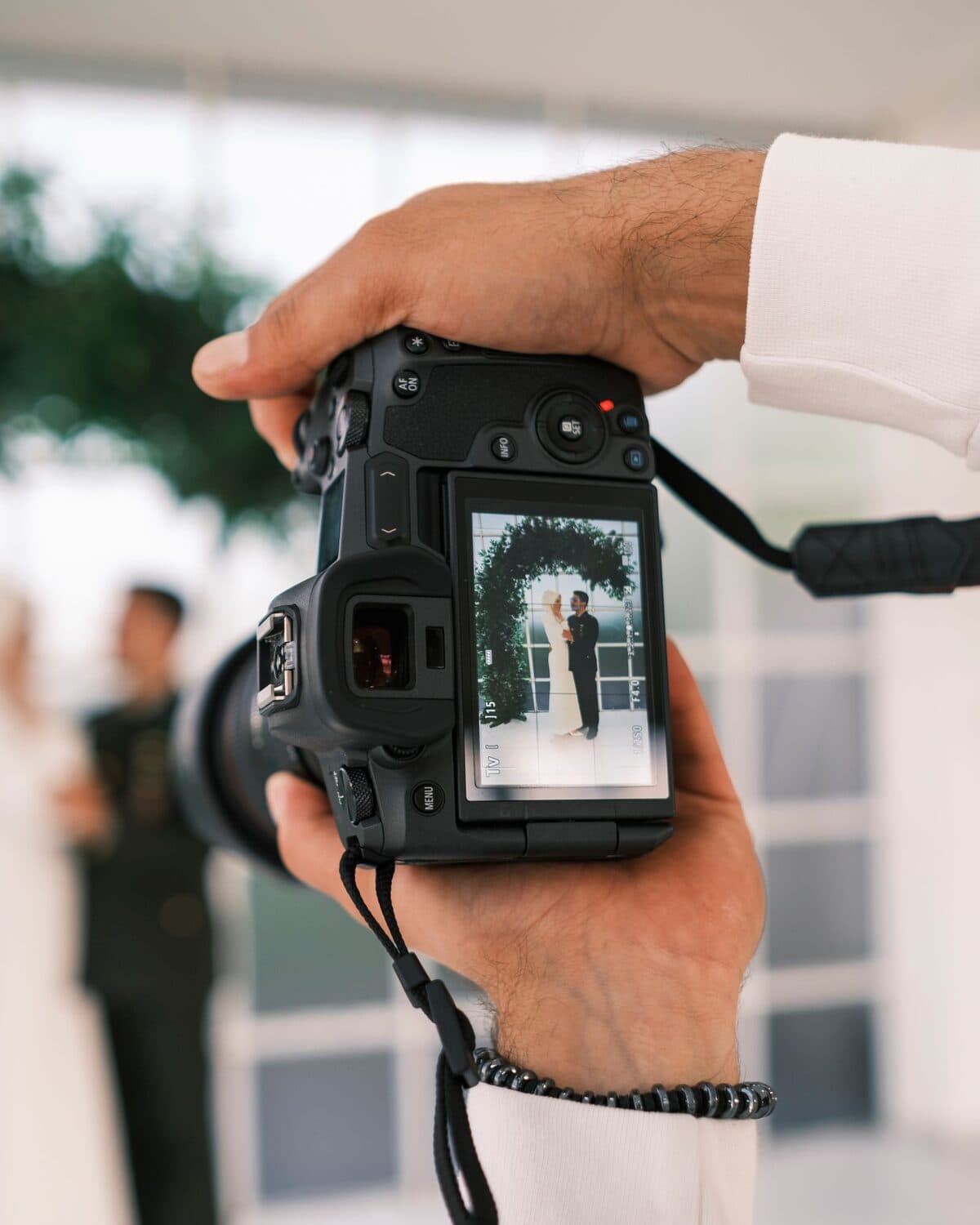 A wedding videographer capturing footage with a professional camera rig